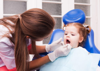 kids visit a dentist